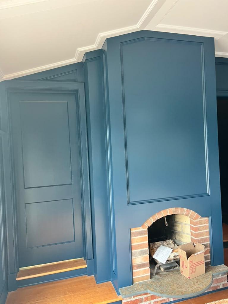 Navy paneled fireplace wall