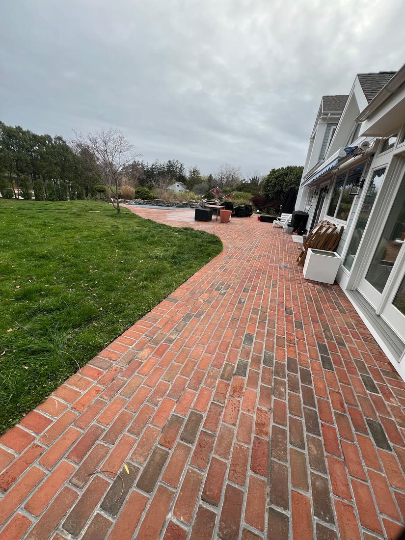 Clean brick path along house