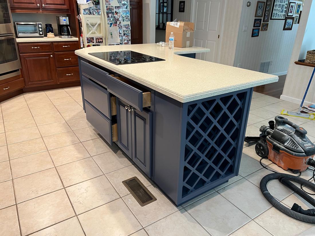 Navy painted kitchen island with wine rack